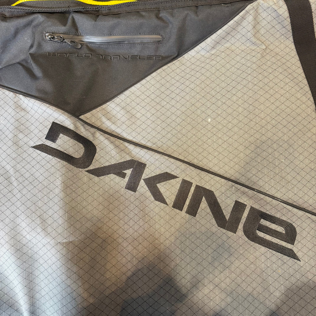 Used Dakine World Traveler Quad Roller Bag