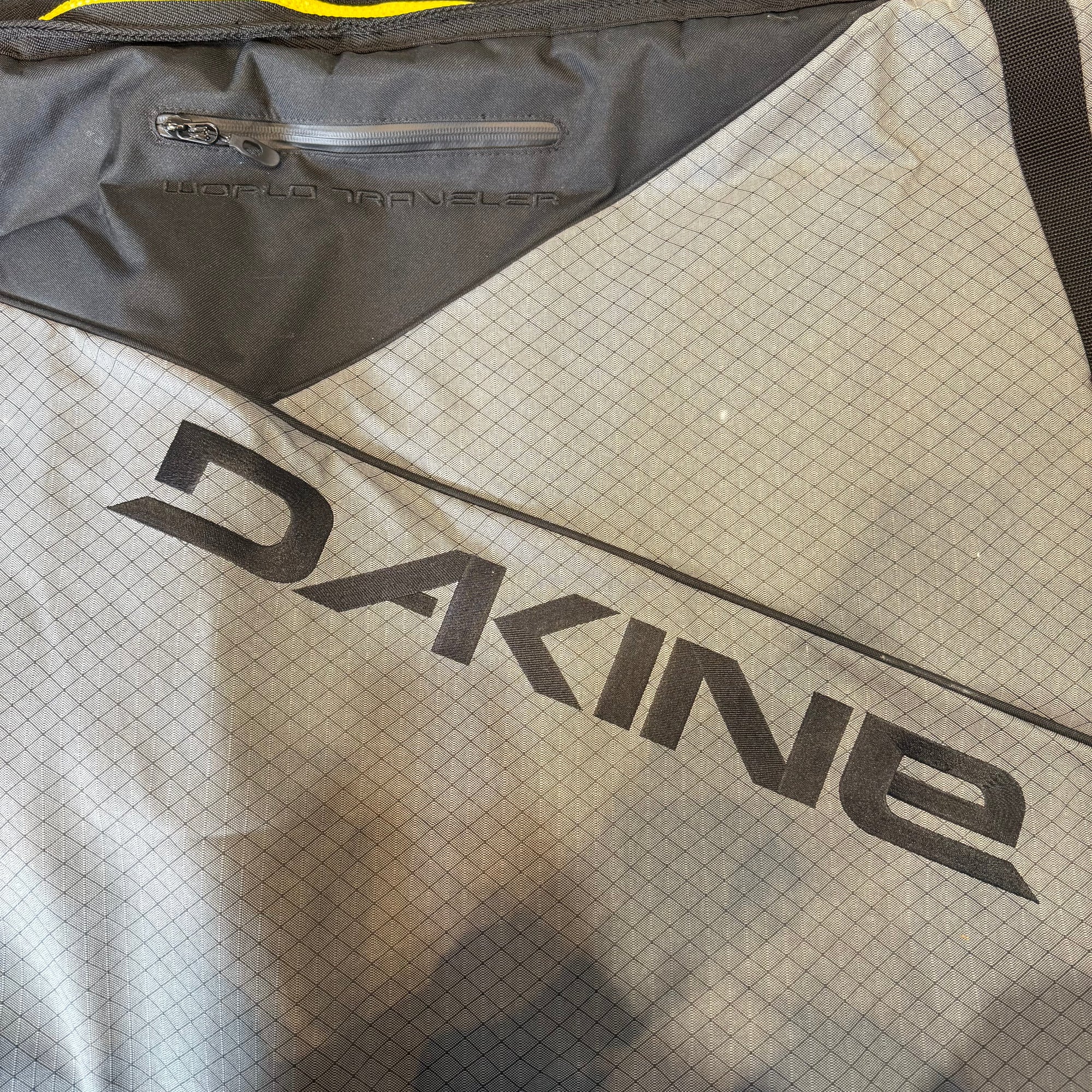 Used Dakine World Traveler Quad Roller Bag